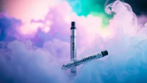 Vapor from a DMT pen wafts through colorful smoke, showcasing the focus on buying DMT.